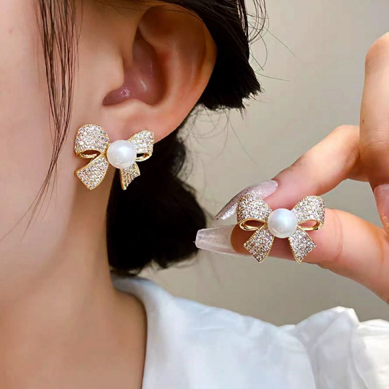 astria-jewellery-crystal-bow-pearl-stud-earrings-for-women-gold-plated-sparkling-bow-earrings-elegant-party-wear-cute-daily-wear-jewellery