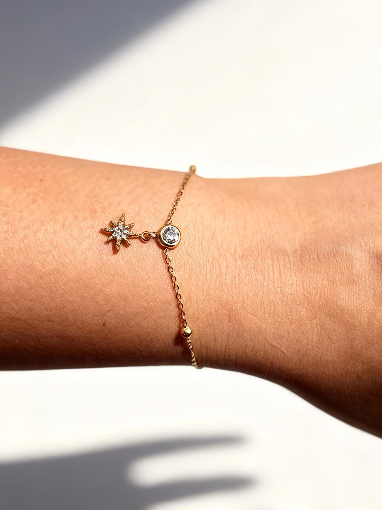 18k gold-plated star charm bracelet �? minimal sleek layerable star bracelet, anti-tarnish and waterproof for everyday wear.