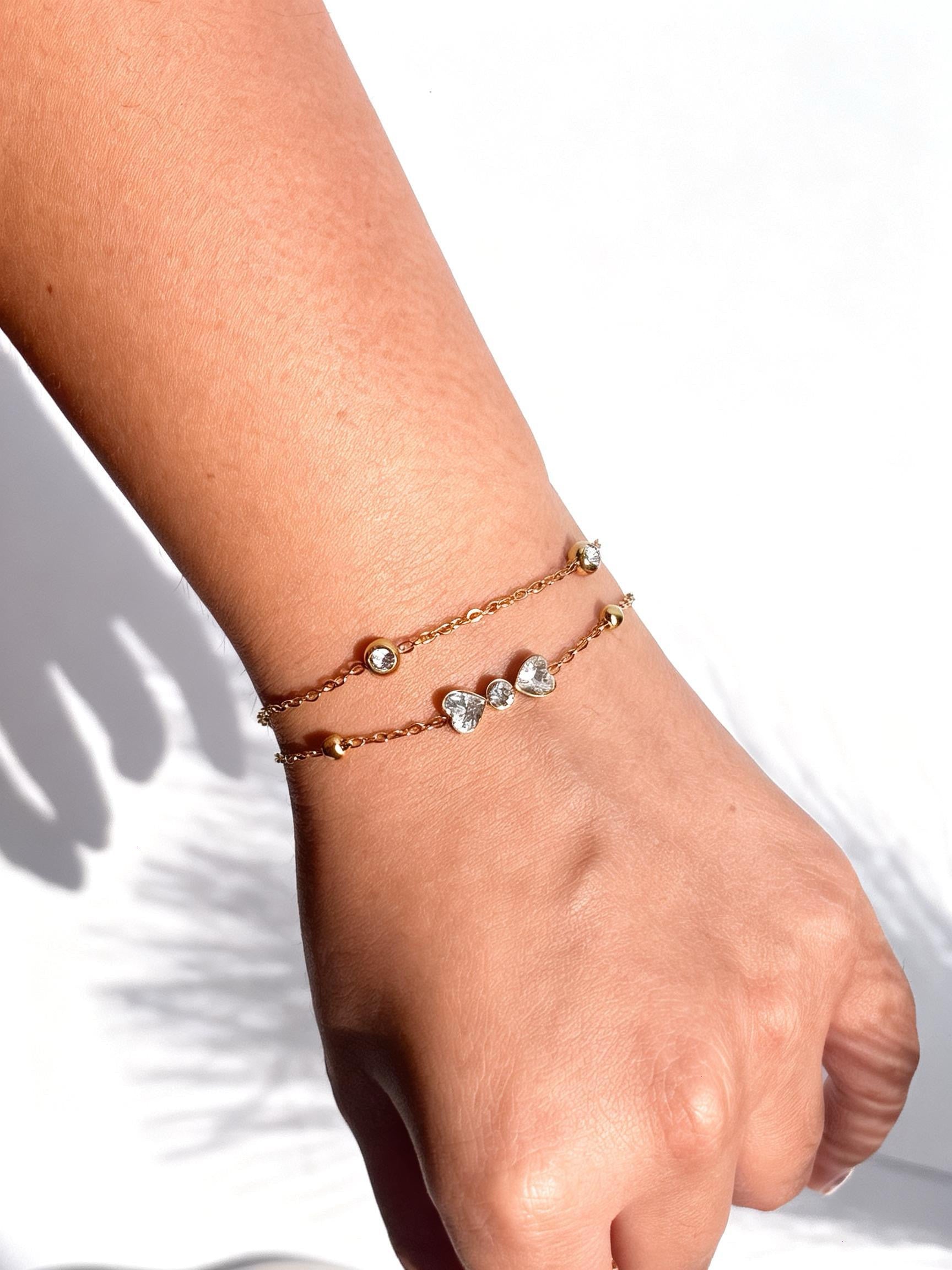 18k gold-plated layered bow bracelet �? sleek layerable bow bracelet, anti-tarnish and waterproof for everyday and casual wear.