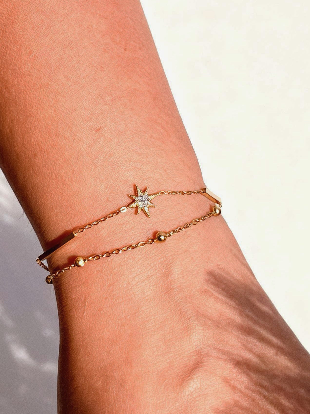 18k gold-plated sun layered bracelet �? sleek sun-charm layerable bracelet, anti-tarnish and waterproof for everyday and casual wear.