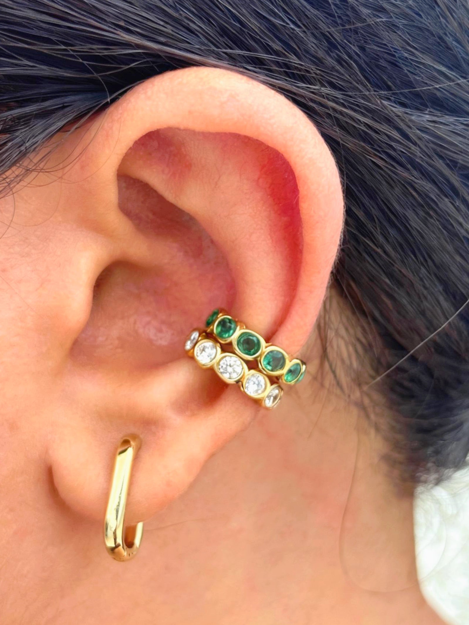 Close-up of gold-plated white stone ear cuff �? sleek lightweight cuff for everyday and evening ear stacks.