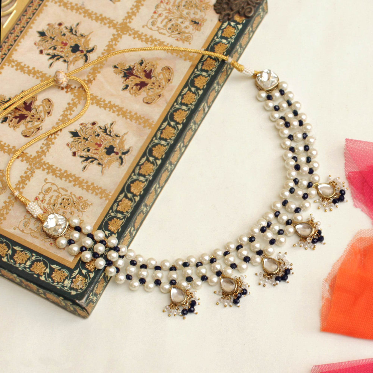 Kundan choker set in gold-tone with matching earrings and long bridal necklace, perfect for wedding functions , festive and bridal wear