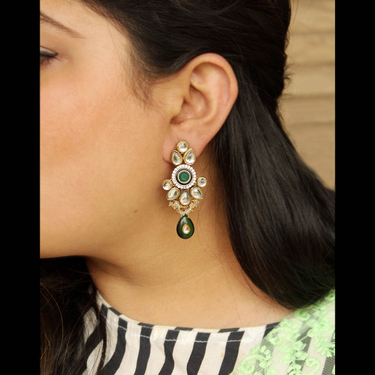 Traditional Kundan earrings in gold-tone, perfect for weddings and festive wear