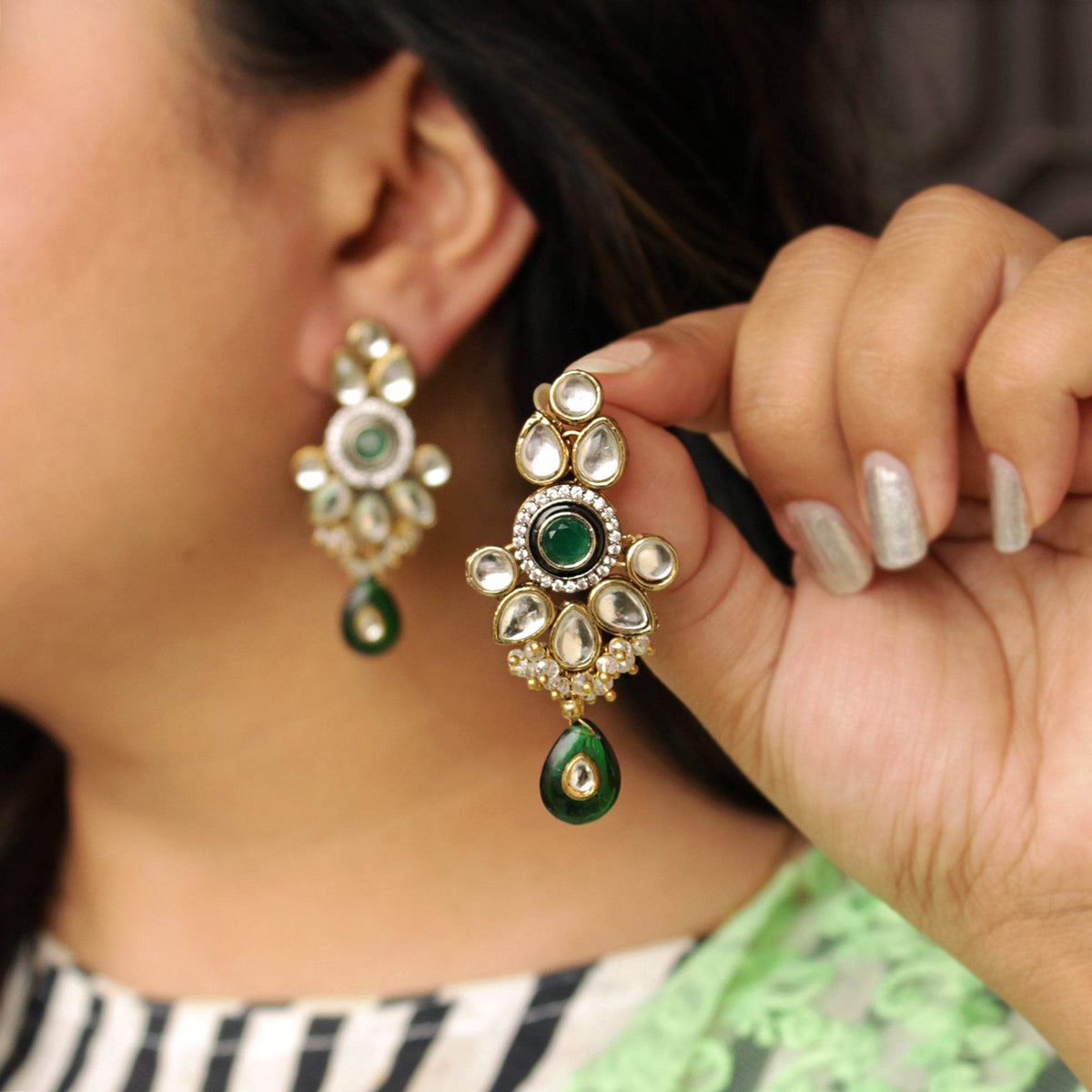 Traditional Kundan earrings in gold-tone, perfect for weddings and festive wear
