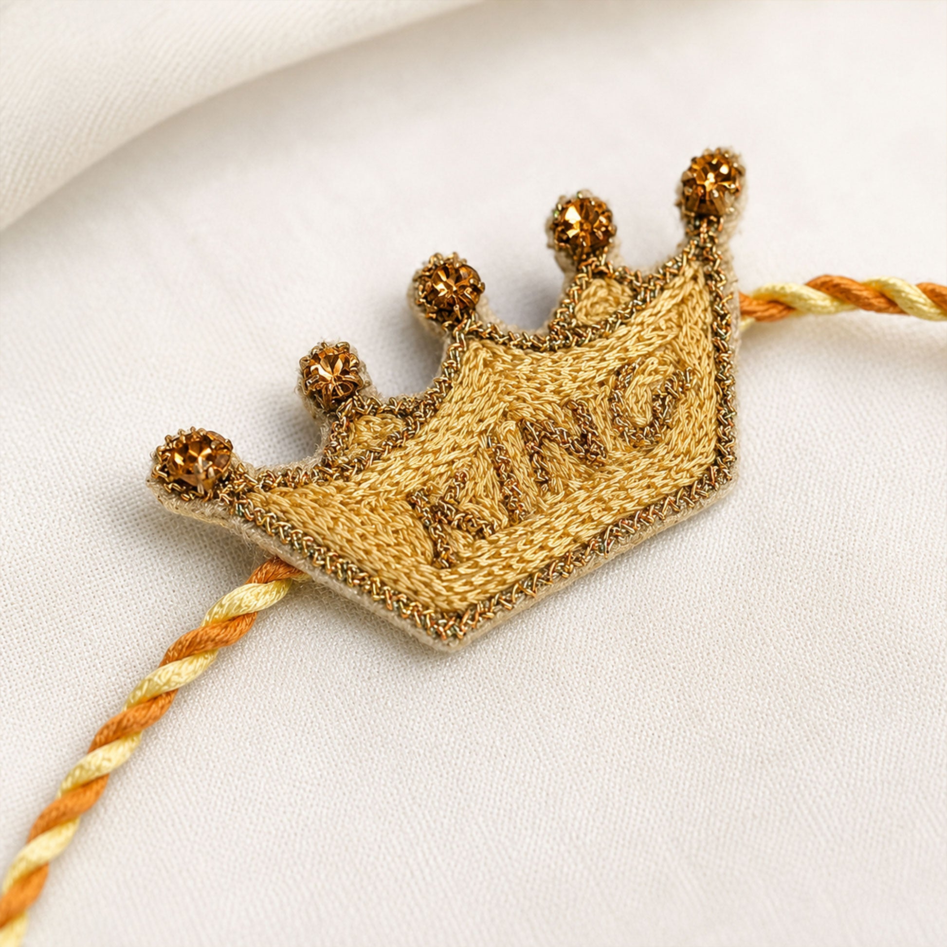 Mere Bhai crown designer rakhi on festive background