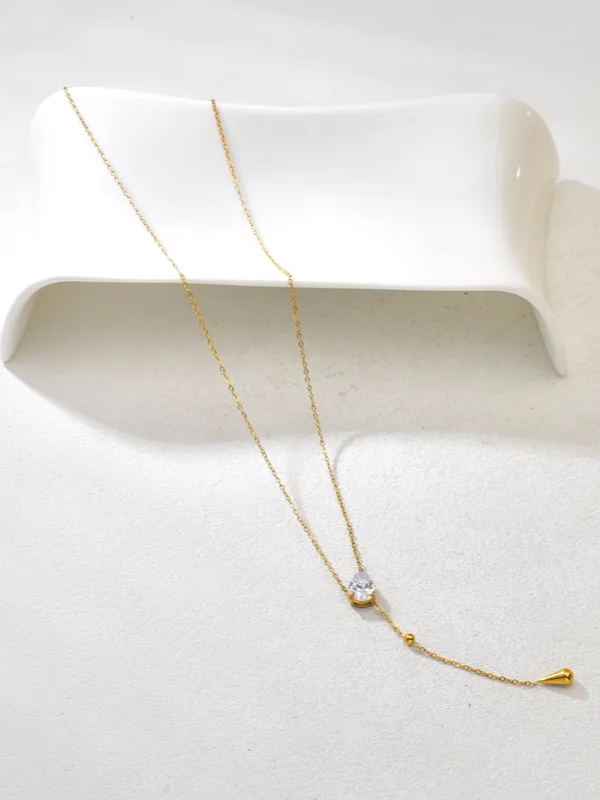 Styled view of stone lariat necklace �? 18k gold-plated lariat for evening and gifting.