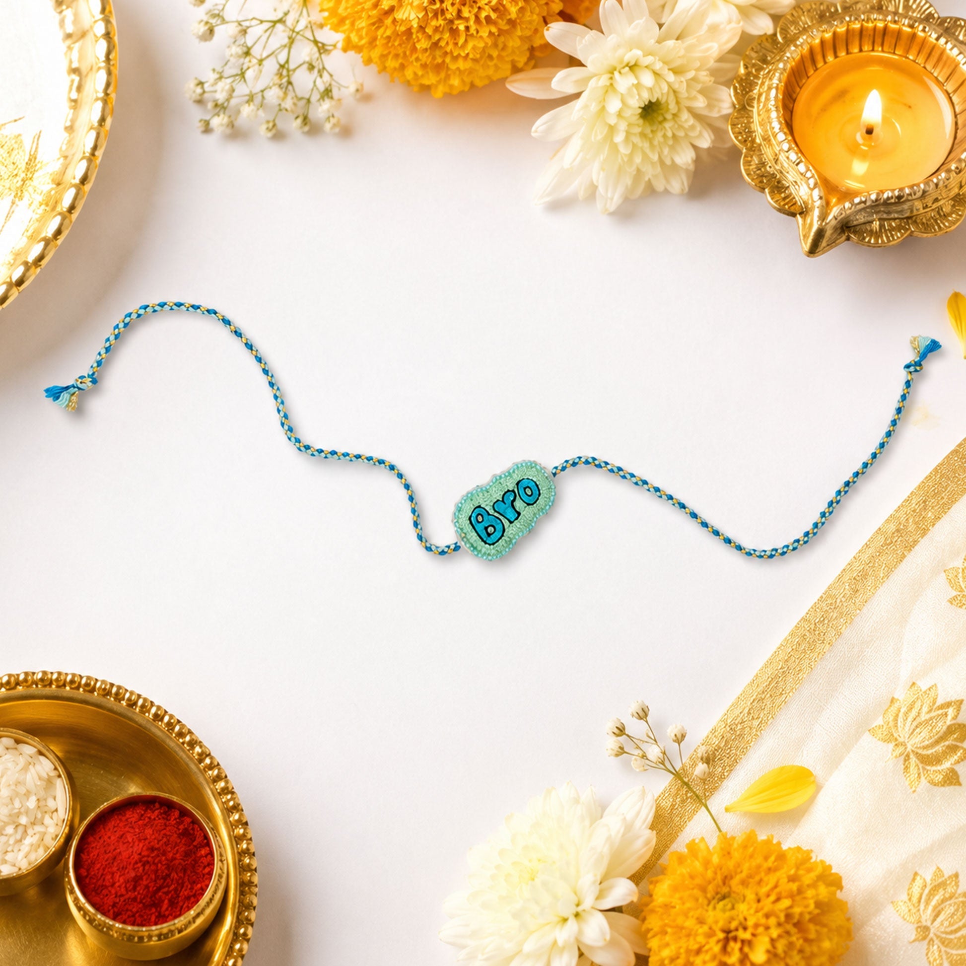 Trendy Bro text rakhi with blue and gold braided thread