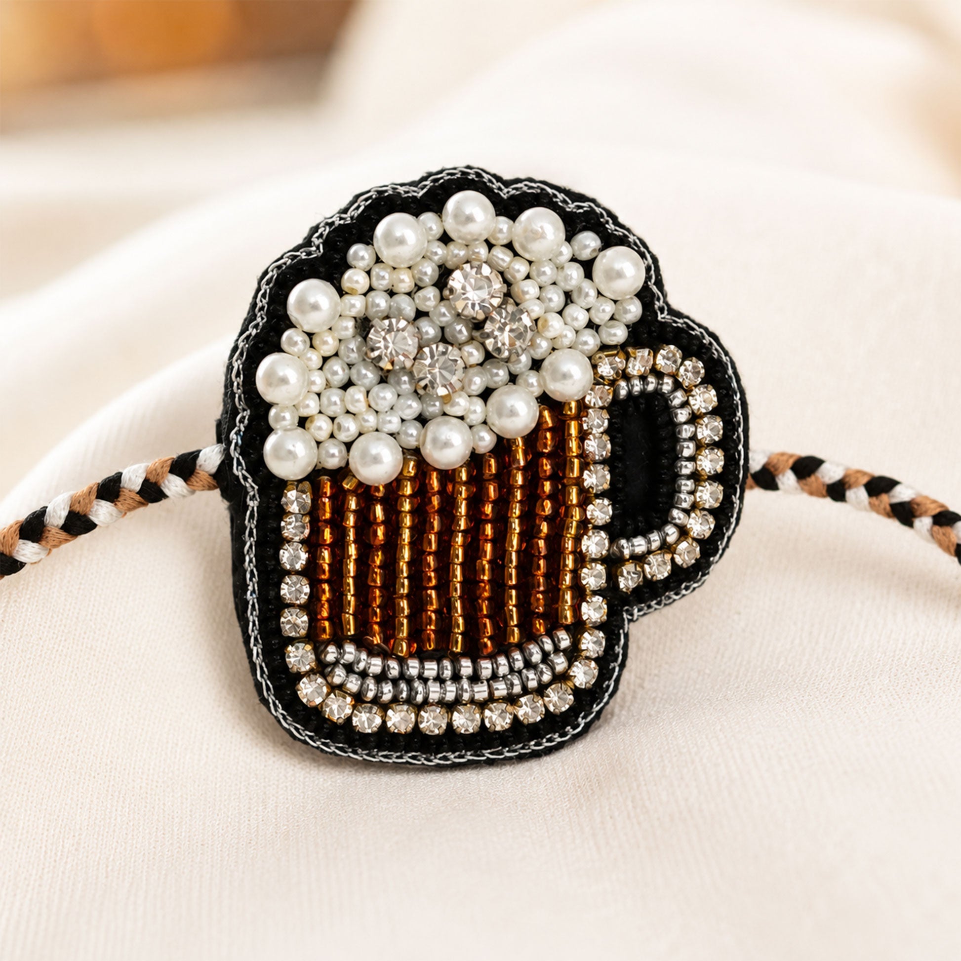 Black brown beverage mug designer rakhi on festive background