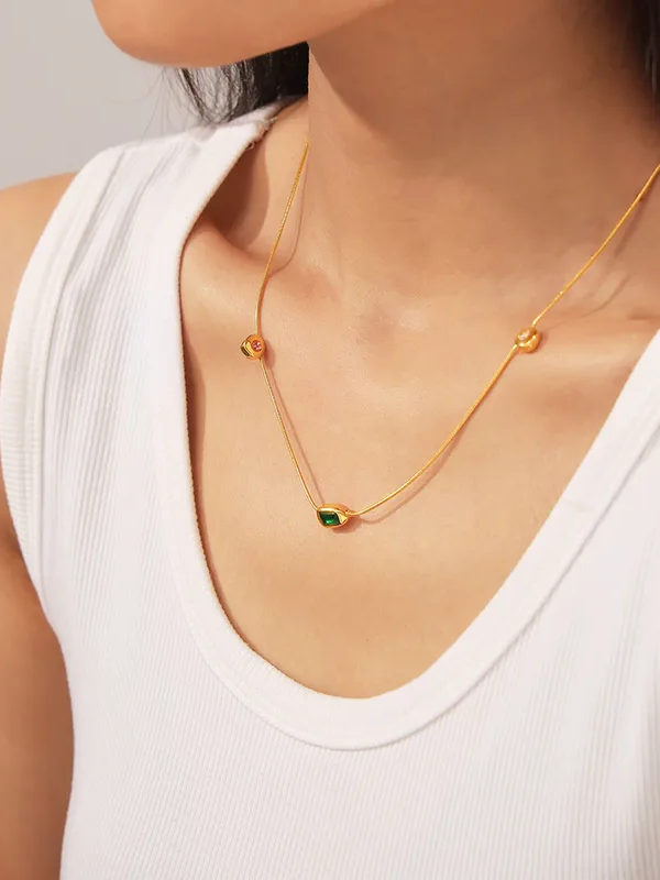 Styled view of Thaira jewelry stack �? 18k gold-plated curated set for layerable everyday styling and gifting.