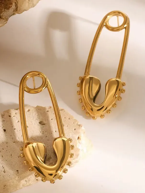 18k gold-plated Pin drop earrings �? unique conversation-starter pin-style drops, anti-tarnish and waterproof for evening wear.