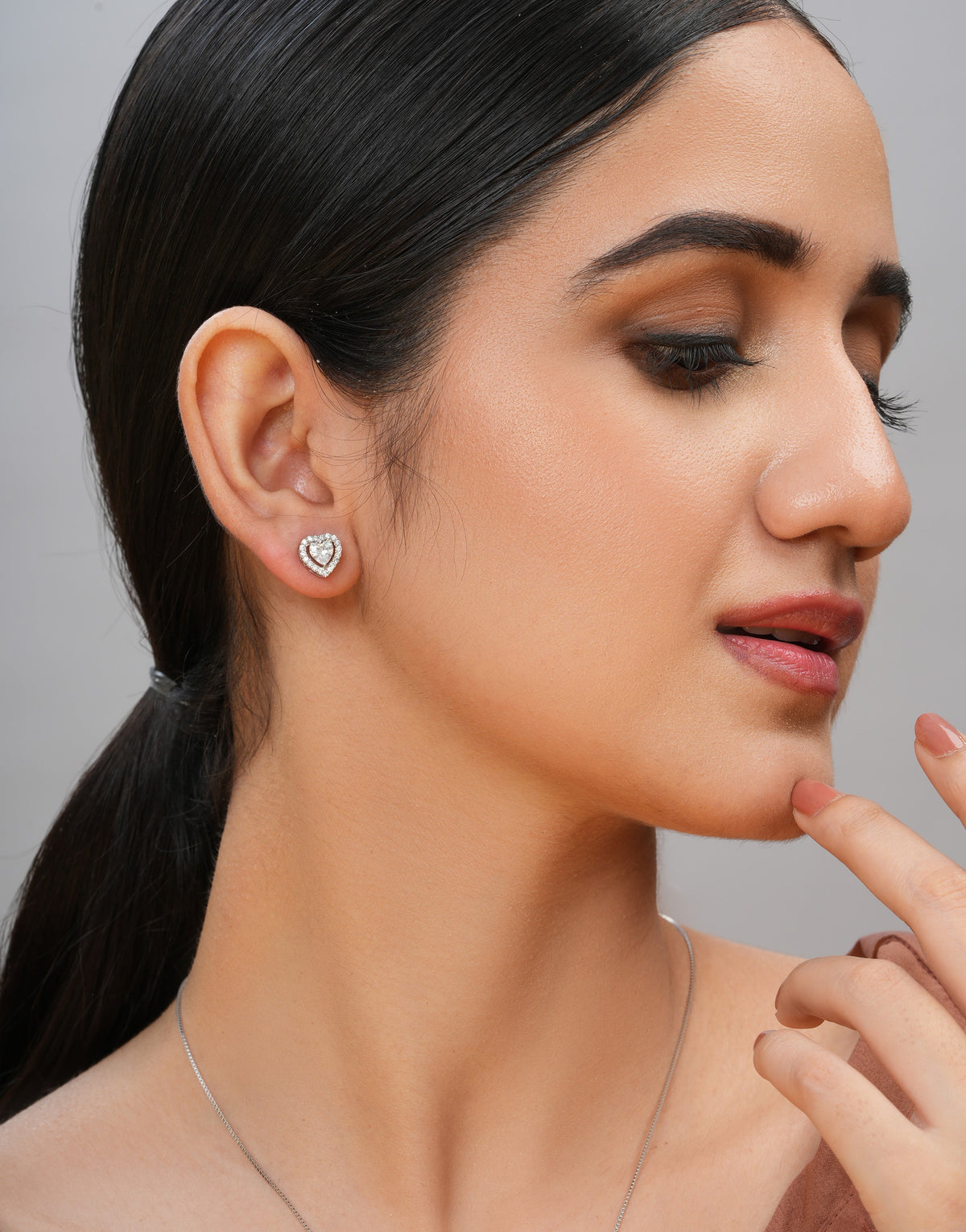 romantic heart-shaped white cz stud earrings with multiple stones