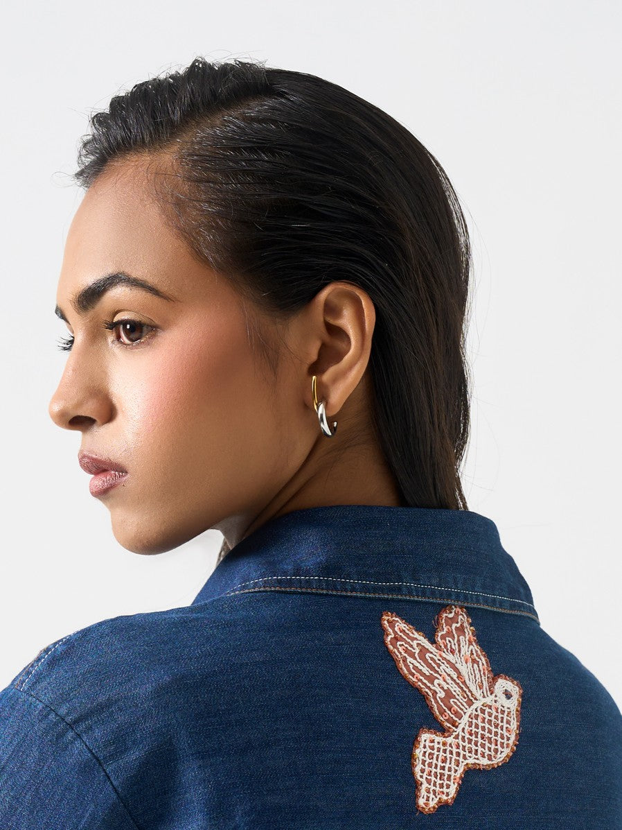 Close-up of illusion drop earrings �? 18k gold-plated mixed metal sleek drops for everyday wear.