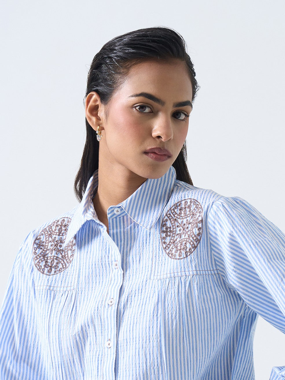 Detail shot of gold-plated Daily Dazzle 2 hoops �? lightweight, waterproof hoops for any occasion.