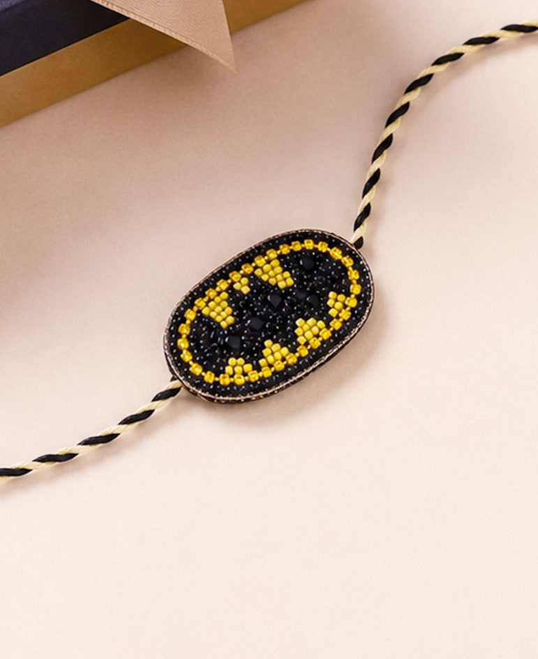 Trendy bat symbol rakhi with black and yellow braided thread