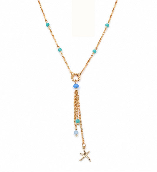 Gold blue beaded starfish tassel necklace on white background