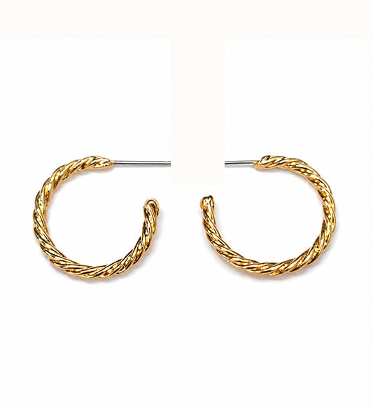 Gold twisted hoop earrings pair on white background