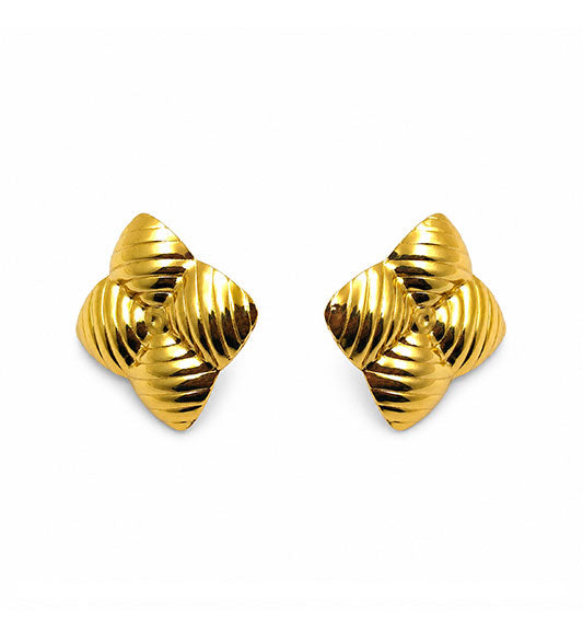 Gold ribbed star stud earrings pair on white background