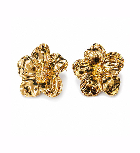 Gold sculpted flower stud earrings pair on white background