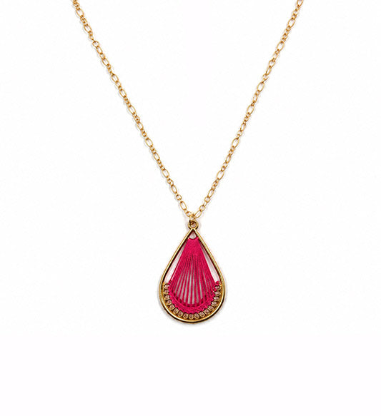 Gold pink thread teardrop pendant necklace on white background