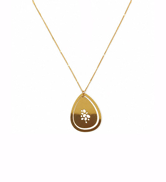 Gold floral cutwork teardrop pendant necklace on white background