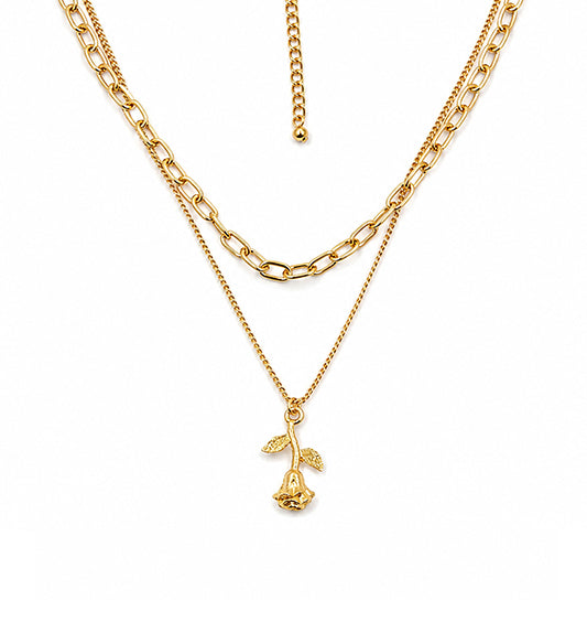 Gold layered rose pendant necklace on white background