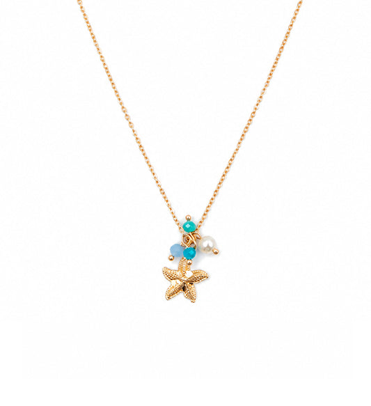 Gold starfish charm pendant necklace on white background
