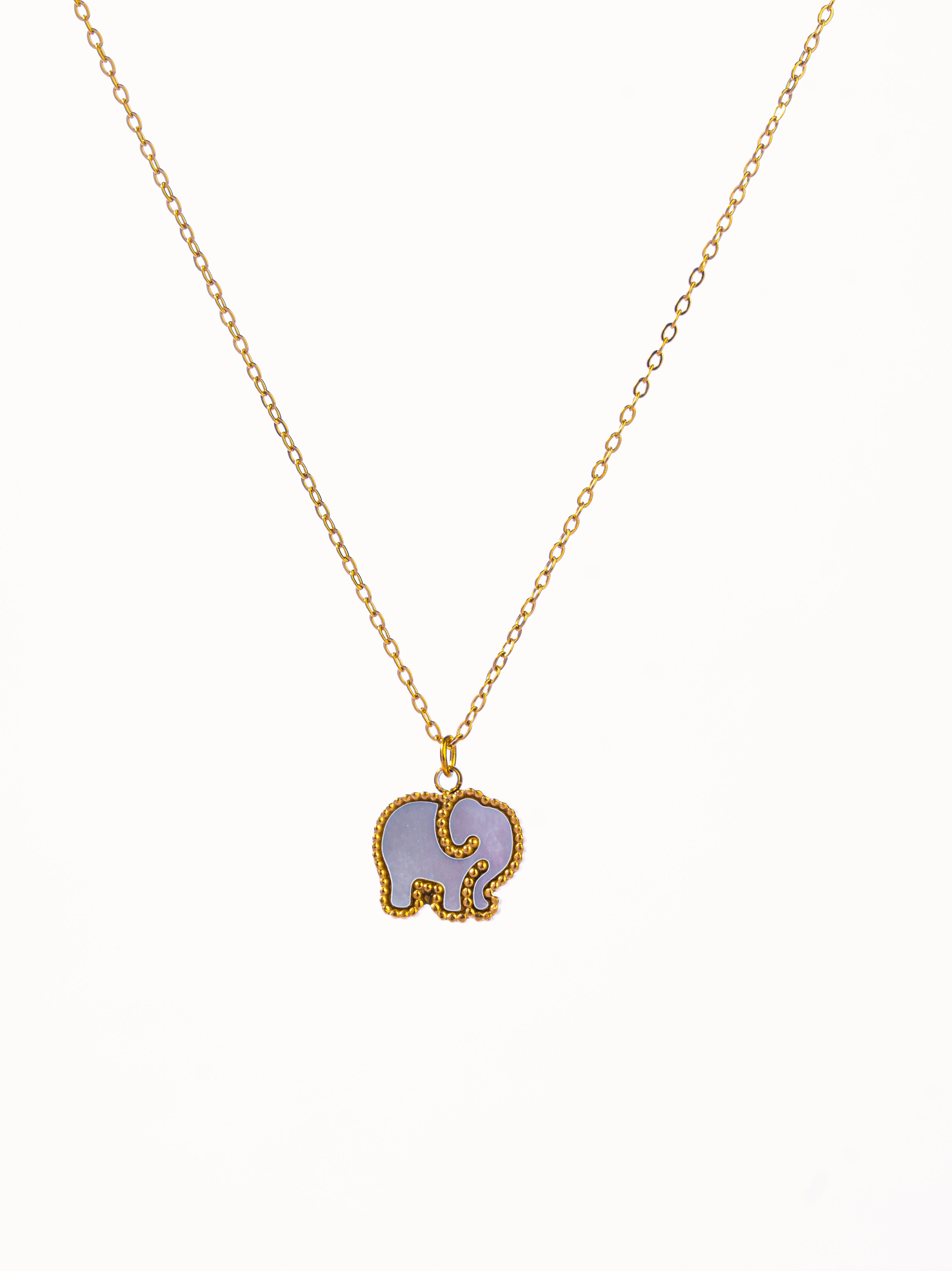 Close-up of Hatti double-sided pendant necklace �? versatile reversible pendant on gold-plated chain for daily wear.