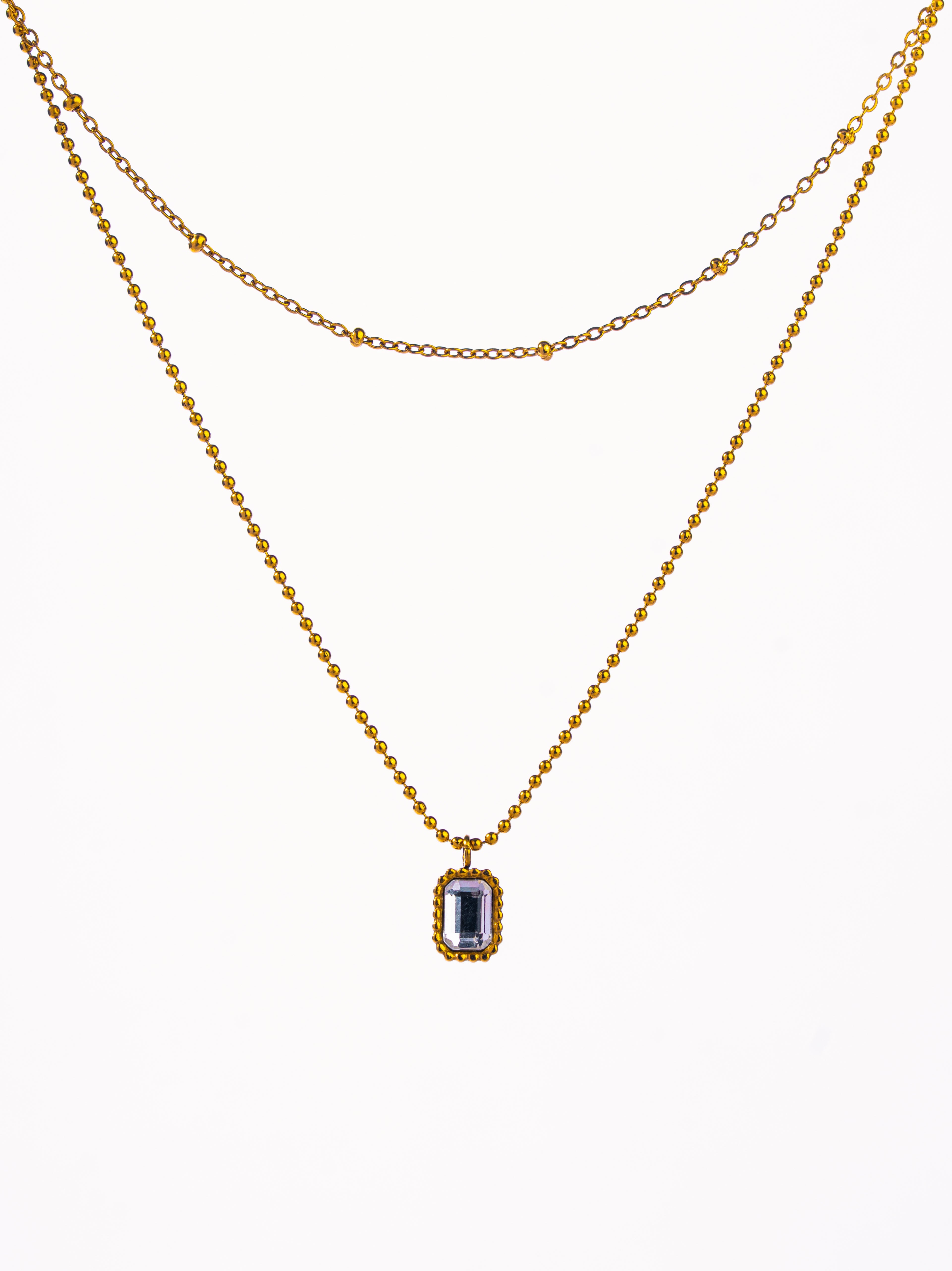 Styled view of double layer chain necklace �? 18k gold-plated elegant layerable necklace for evening and gifting.