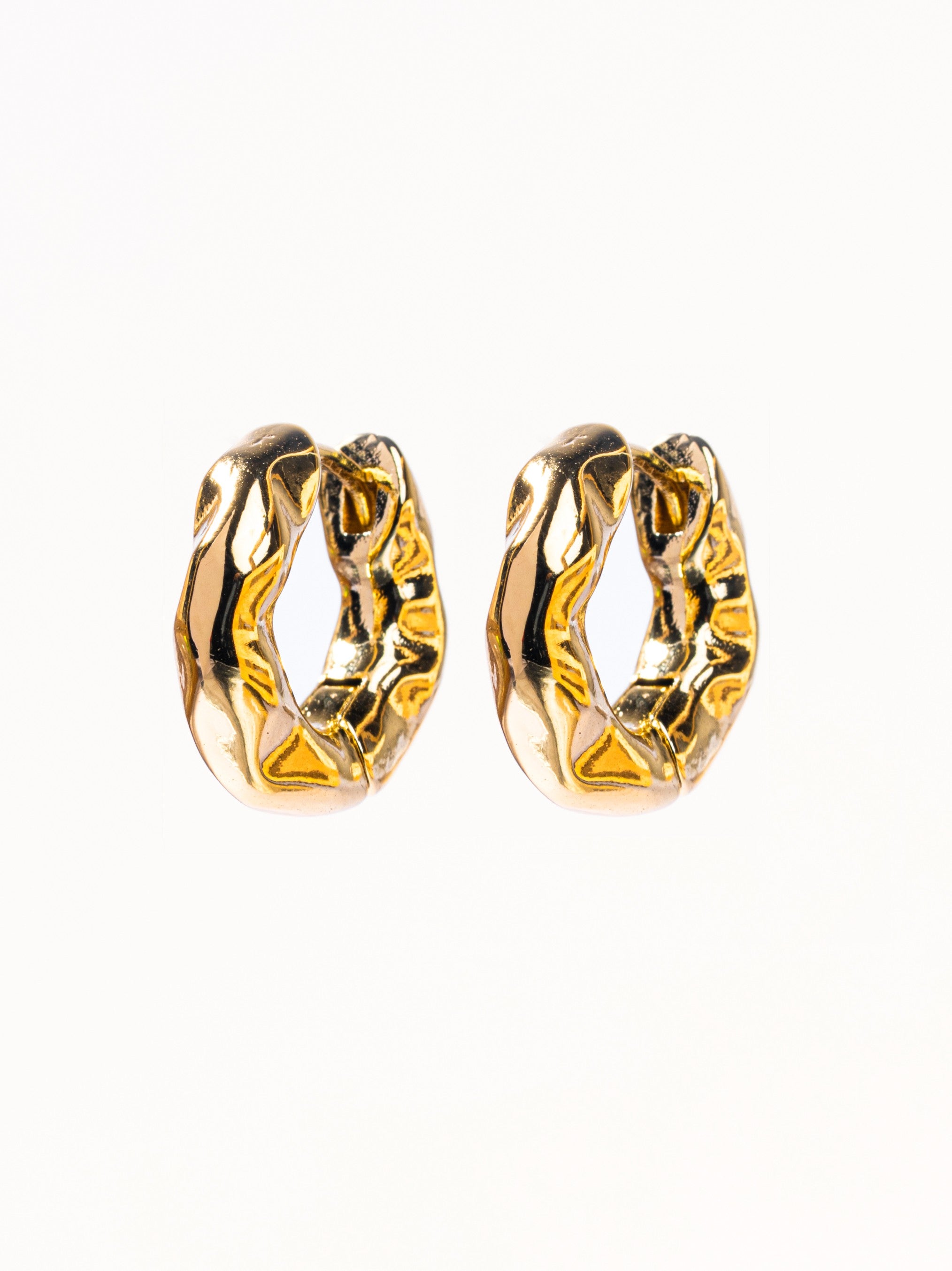 Pair of gold chunky hoop earrings �? bold lightweight hoops styled for casual, evening, and gifting occasions.