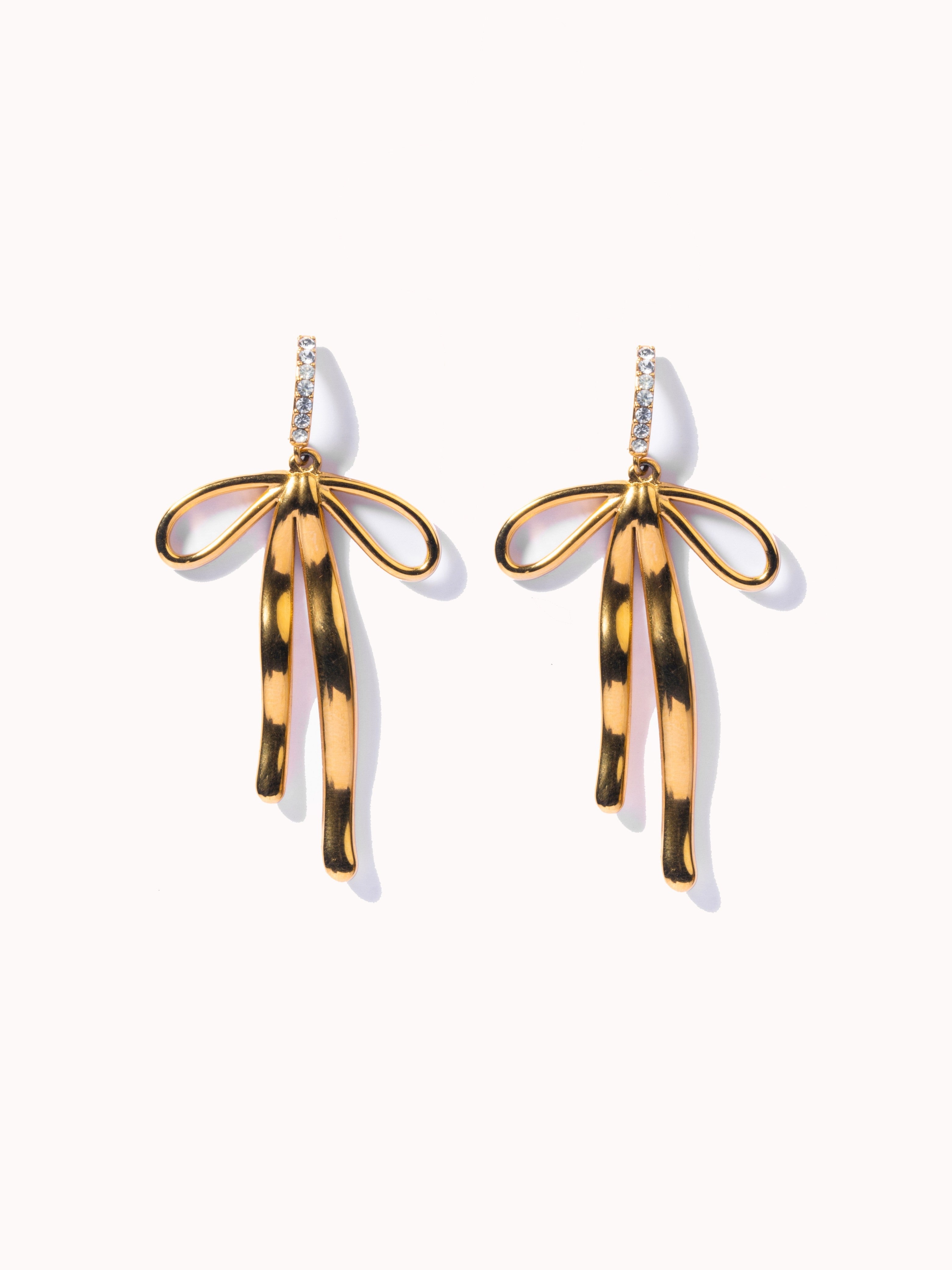 18k gold-plated Bow drop earrings �? chic long white-stone bow statement drops, anti-tarnish and waterproof for evening and festive wear.