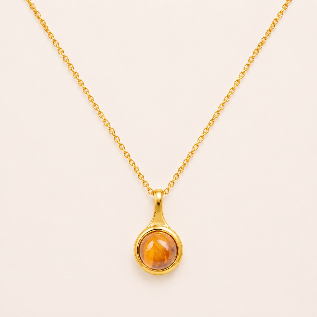 Chinoiserie-inspired round gold pendant necklace with Eastern artistic motif design