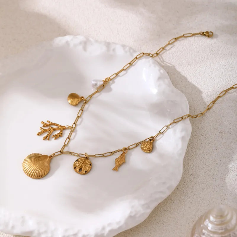 Styled view of shell choker �? 18k gold-plated bold summer necklace for festive and gifting.