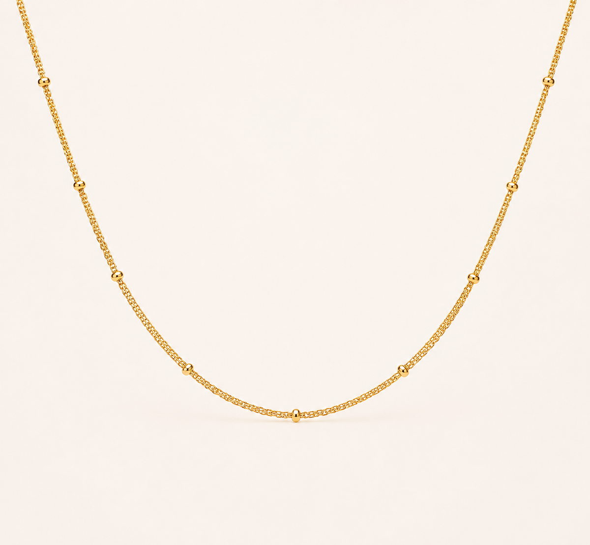 Classic Figaro pattern gold chain necklace with alternating links and high-polish finish