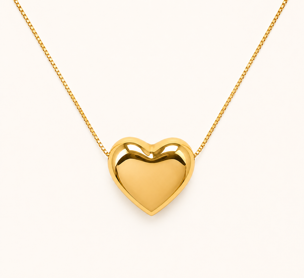 Classic soft heart pendant gold necklace with polished gold-tone finish on fine chain
