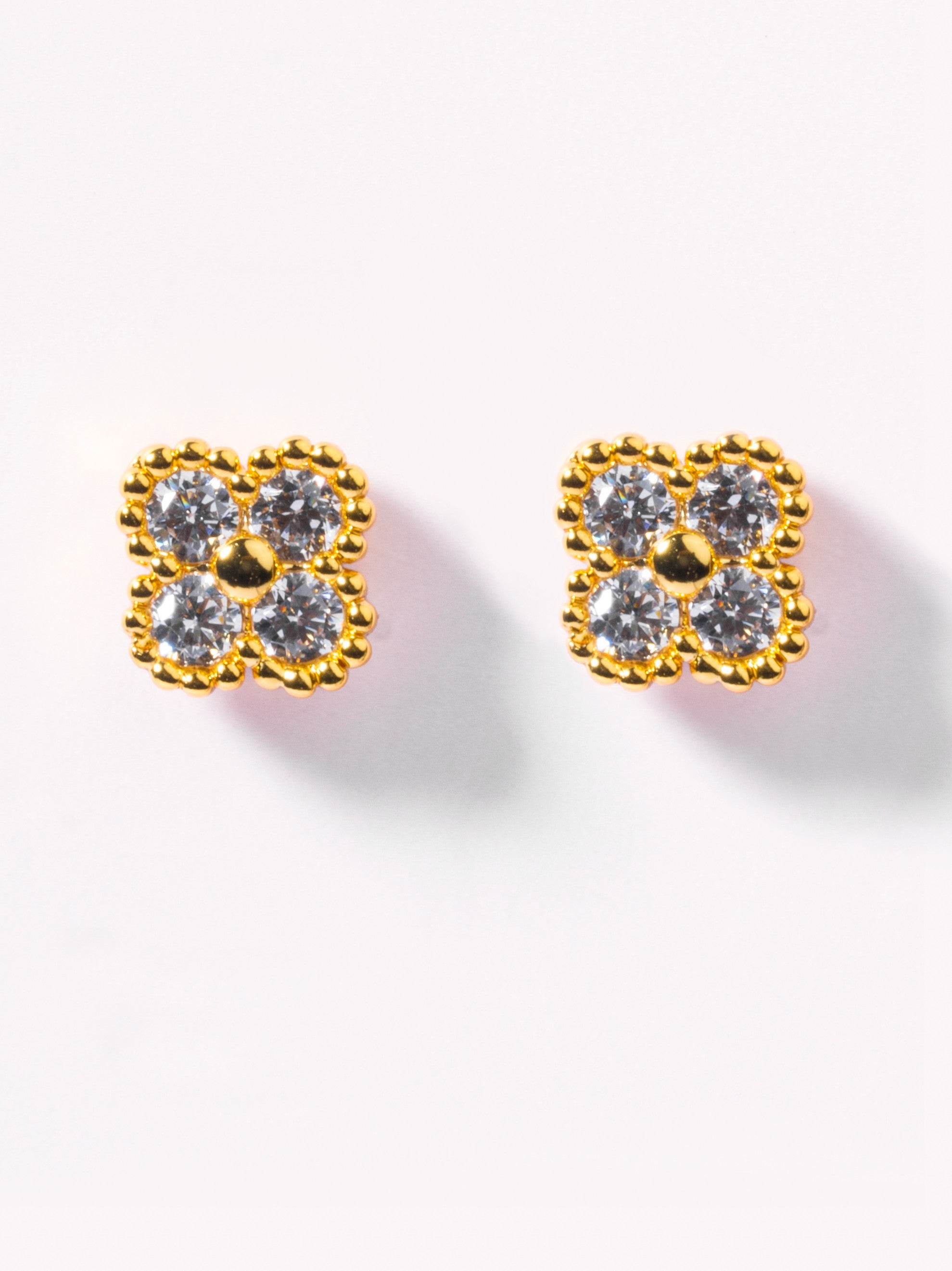 Pair of gold-plated clover studs �? sleek modern studs styled for everyday wear, casual styling, and gifting.