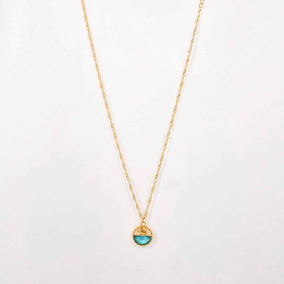 Dopamine Ocean Wave Pendant Necklace – wave-pattern blue enamel pendant in textured gold plated frame