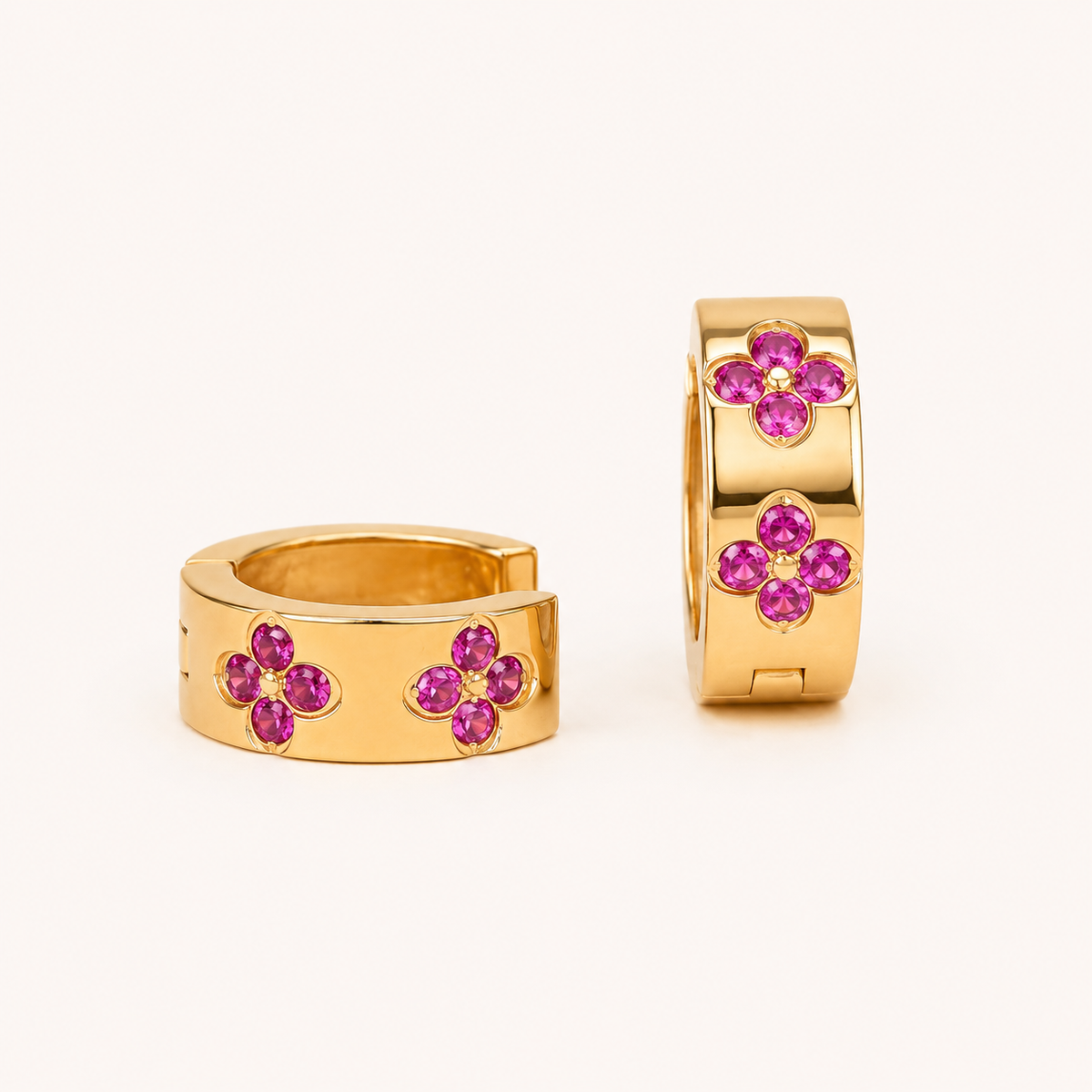 Edge Clover Crystal Huggie Hoop Earrings – wide-profile gold plated huggie hoops with clover crystal motifs