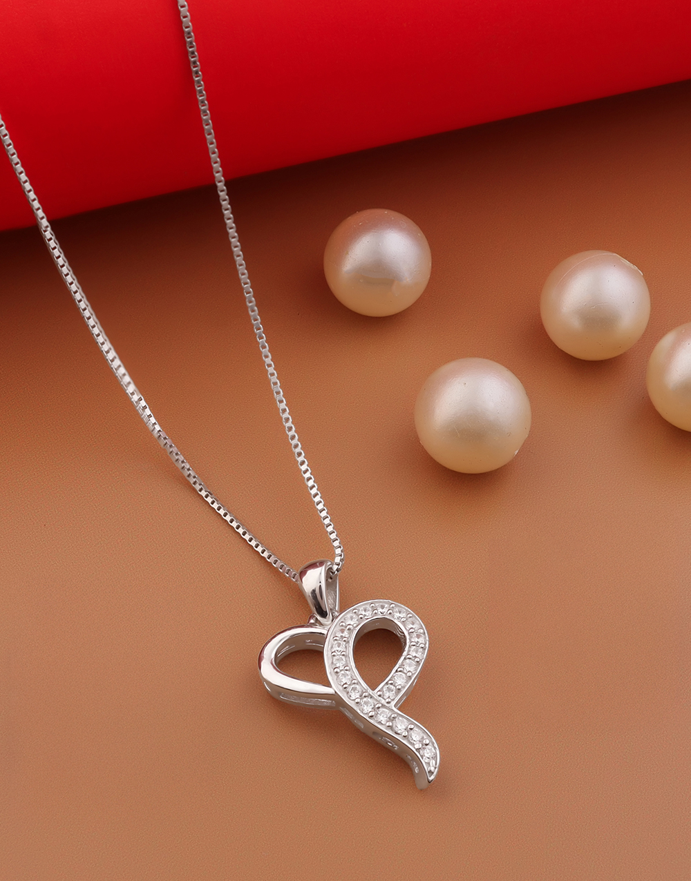 Elegant Ribbon-Inspired Pendant Adorned with Sparkling CZ Stones for a Graceful Look