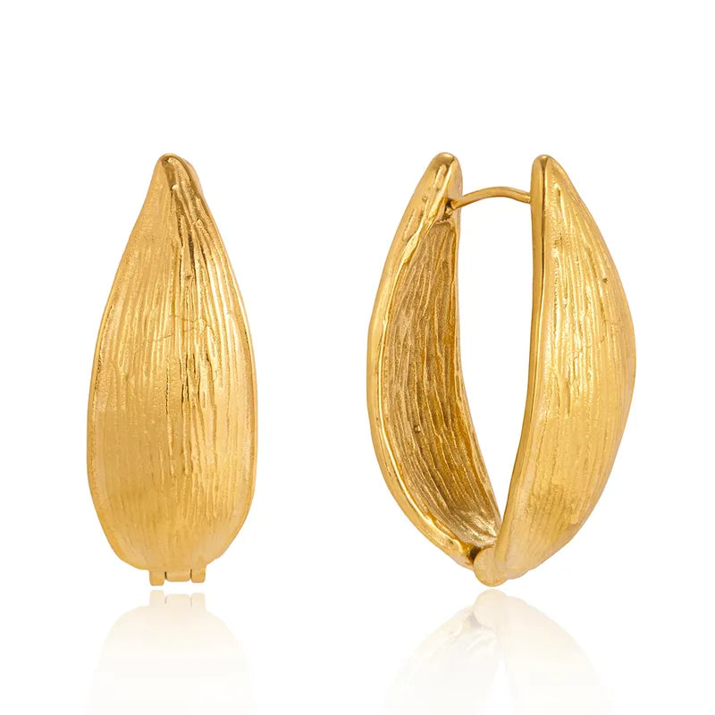 Pair of chunky 18k gold-plated Liva hoops styled for office and evening �? bold anti-tarnish gold hoops.