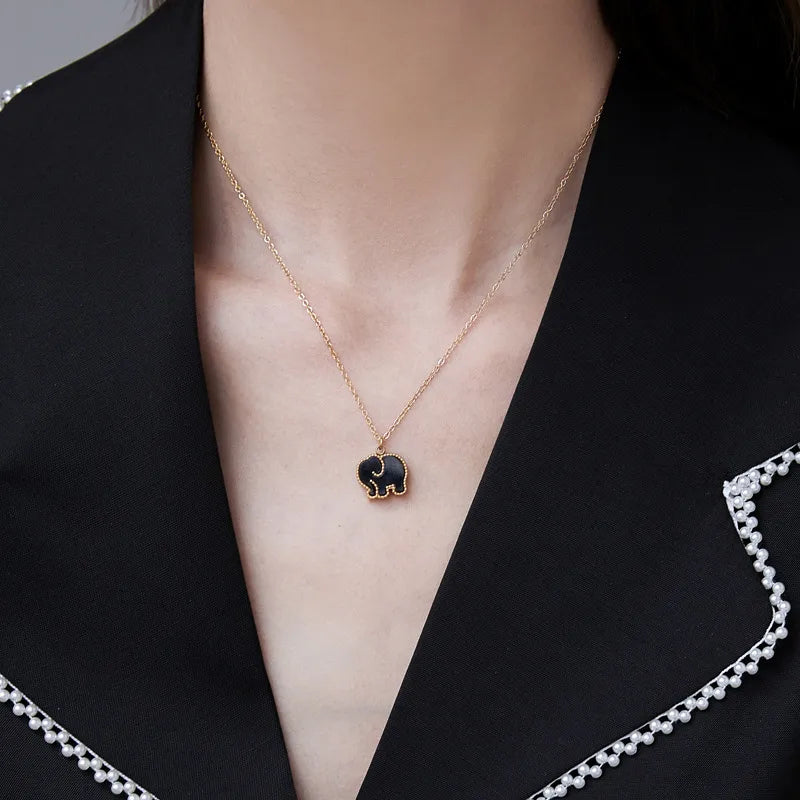 Detail shot of Hatti double-sided pendant �? durable gold-plated chain pendant for everyday and evening wear.