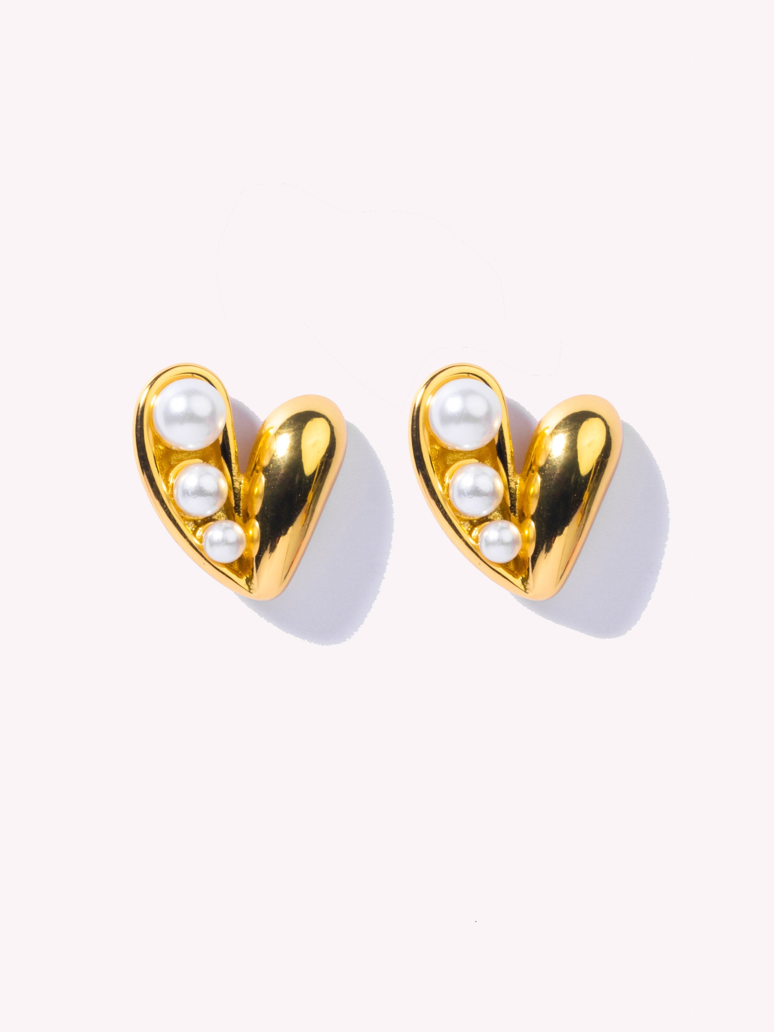 18k gold-plated heart pearl stud earrings �? delicate minimal heart pearl studs, anti-tarnish and waterproof for everyday and casual wear.