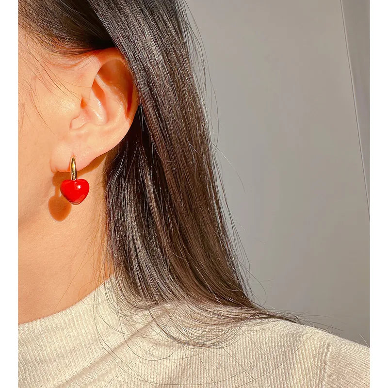 18k gold-plated red heart stone earrings �? ruby-toned red heart drops, anti-tarnish and waterproof for festive, ethnic and party wear.