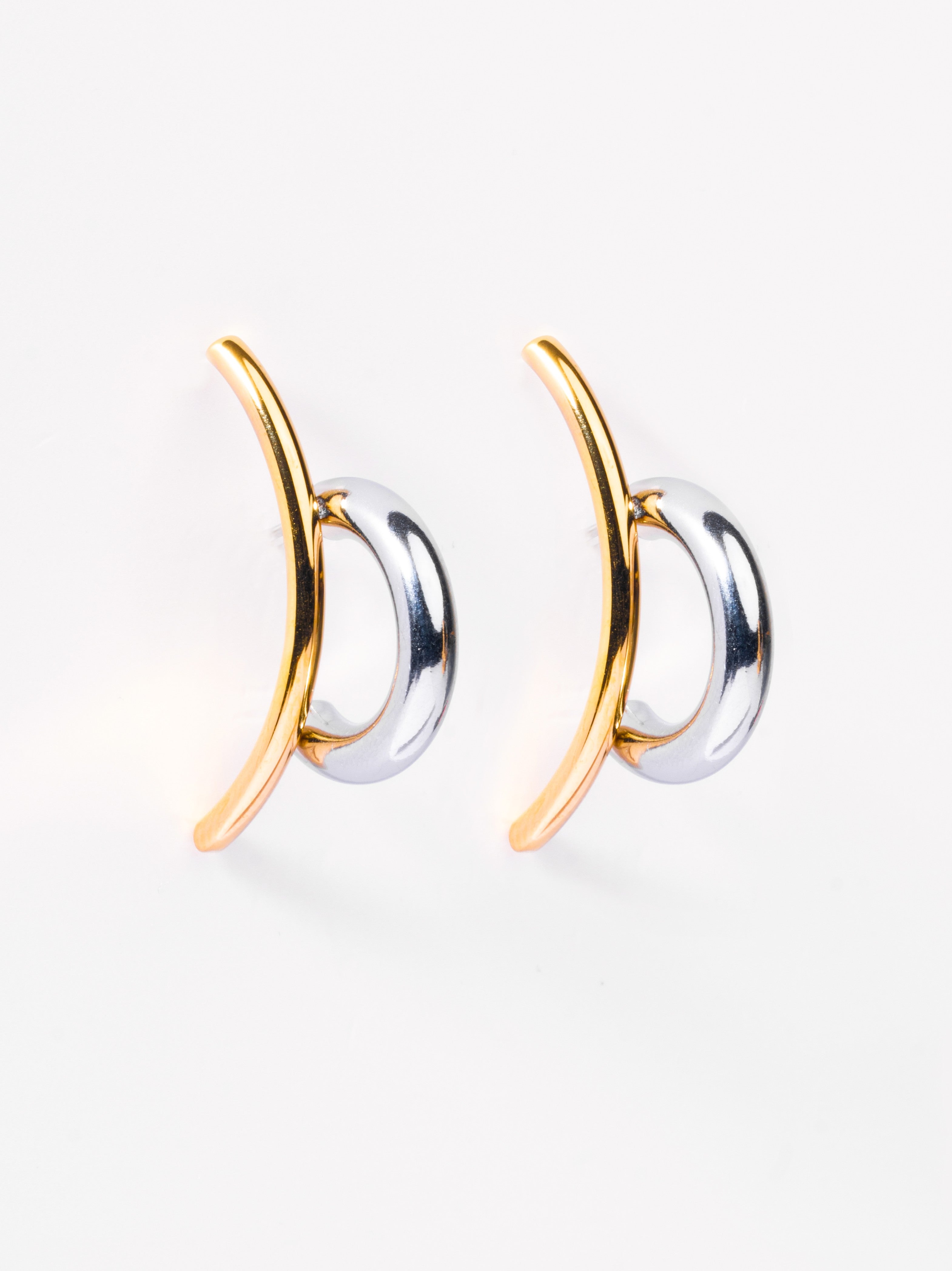 Styled view of illusion drop earrings �? 18k gold-plated mixed metal modern drops for evening and gifting.