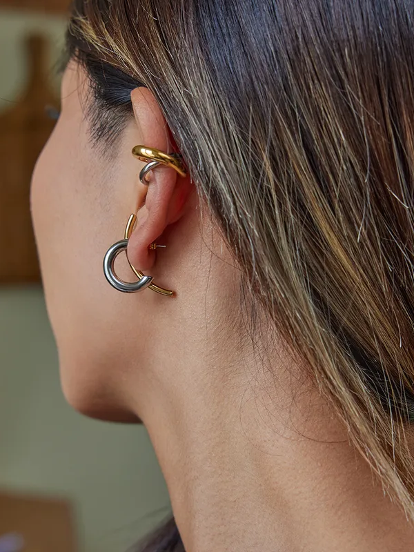 Pair of illusion drop earrings �? 18k gold-plated and silver-plated mixed metal drops for modern styling.