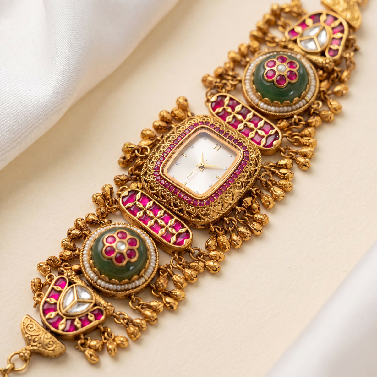Antique Gold White Dial Ruby Bezel Ruby Bar Green Cabochon Ghungroo Bracelet Watch for Women & Girls | Stylish Watch | Wrist Watches for Girls | Ideal for gifting | Gift for Diwali, Christmas, Marriage, Birthday, anniversary, wedding