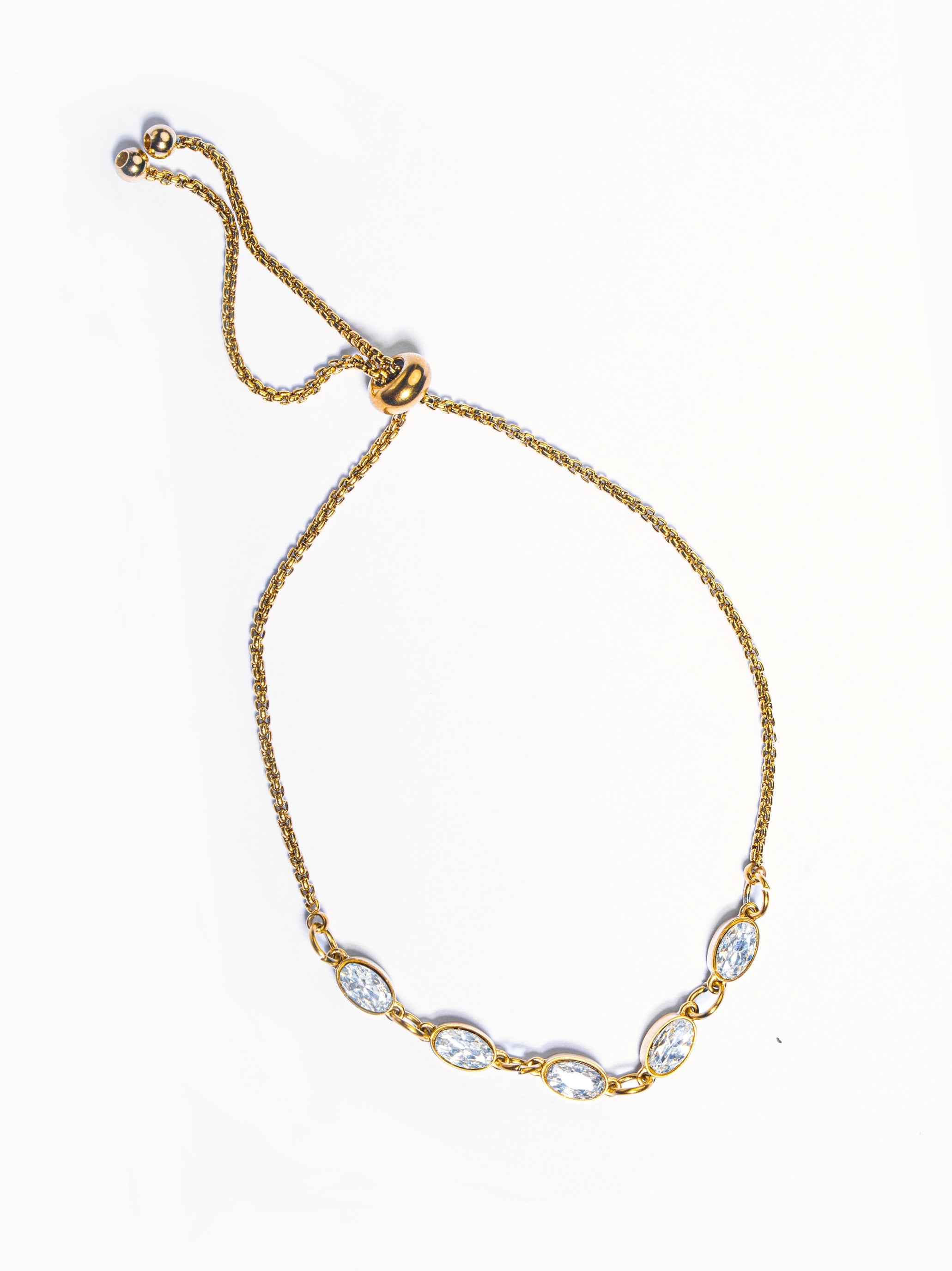 18k gold-plated Twirl bracelet �? sleek layerable durable bracelet, anti-tarnish and waterproof for everyday and casual wear.
