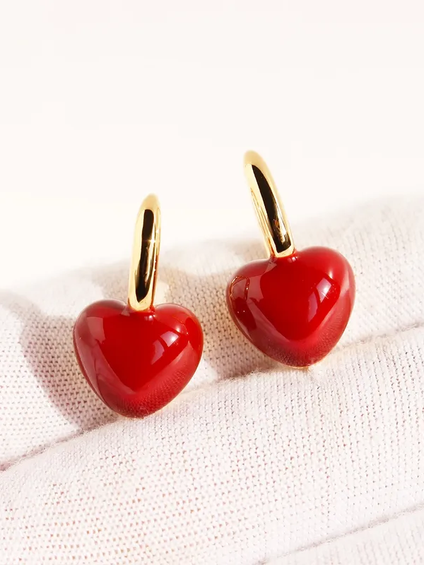 Pair of red heart stone earrings �? 18k gold-plated ruby heart drops for festive and gifting.