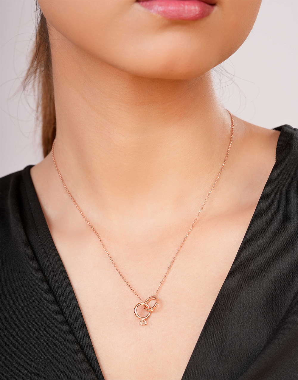 Rose Gold Interlocking Circles Pendant Necklace with Dangle Stone