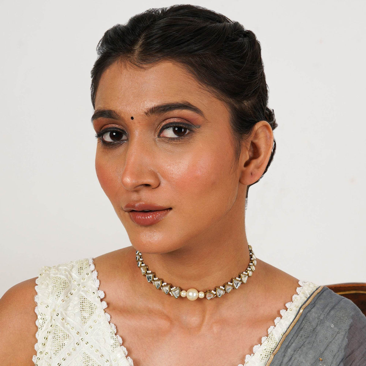 Kundan choker set in gold-tone with matching earrings and long bridal necklace, perfect for wedding functions , festive and bridal wear