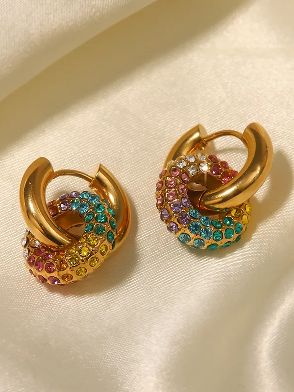 Close-up of gold-plated colour huggie earrings �? lightweight, hypoallergenic huggies with vibrant stone charm.
